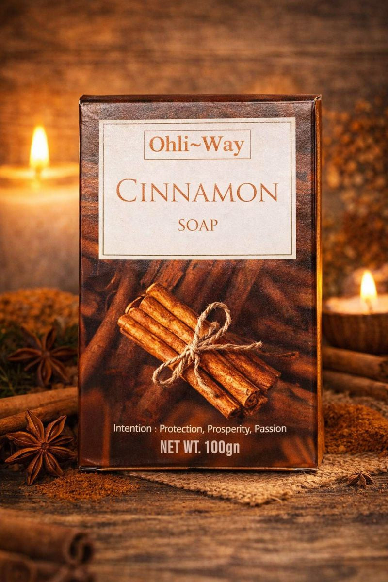 Ohli-Way Cinnamon Soap packaging with cinnamon sticks on a wooden background