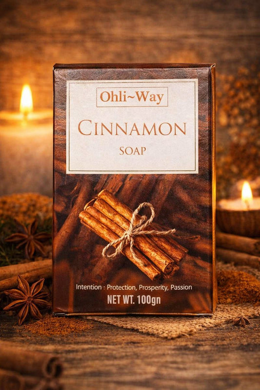 Ohli-Way Cinnamon Soap packaging with cinnamon sticks on a wooden background
